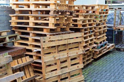 Staff member assisting a business customer with arranging commercial waste removal in West Ham